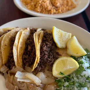 a plate of tacos and rice