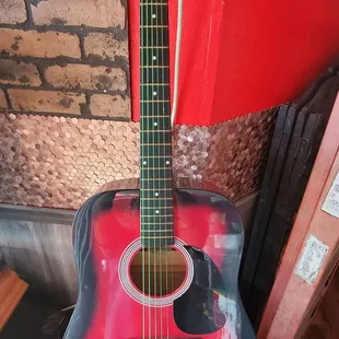 a red acoustic guitar