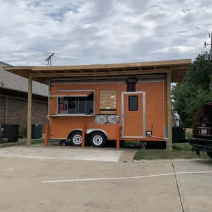 a taqueria truck parked in a parking lot