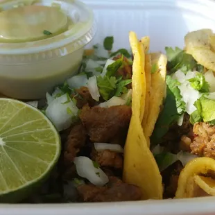 Two fajita street tacos $1.25 each. Their green salsa is spicy and delish on the tacos.