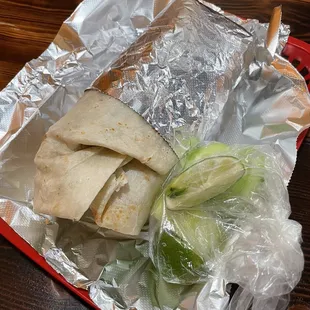 a tortilla wrapped in aluminum foil