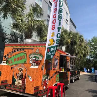 a taqueria truck parked in front of a building