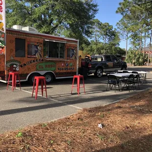 a taqueria truck parked in a parking lot