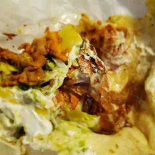 A look into the pork burrito it's not as filled like most trucks.