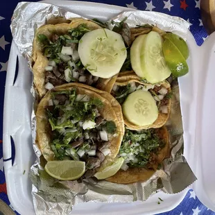 Pollo chicken taco, asade steak taco, chorizo sausage taco, and carnitas pork taco