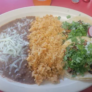 Plate #4- 2 tacos, rice and beans-$9.95