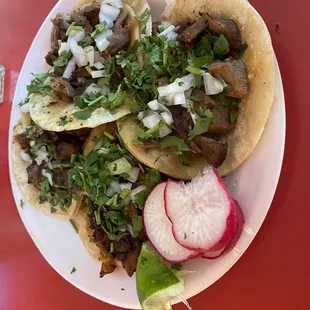 4 tacos - lengua $1.95, cabeza $1.95, pastor $1.69