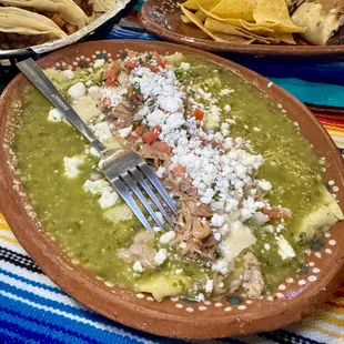 Enchiladas verdes - corn tortillas filled with chicken and cheese covered with a homemade tomatillo sauce