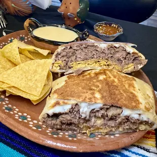 Crunch wrap - hard corn tortilla, cheese &amp; carne asada (seasoned ribeye), wrapped in a flour torilla, and grilled