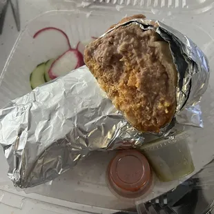 Huge egg and chorizo burrito!! Takes up the entire to go container!