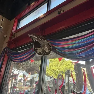 Colorful draping fabric with centered sombrero dress the windows