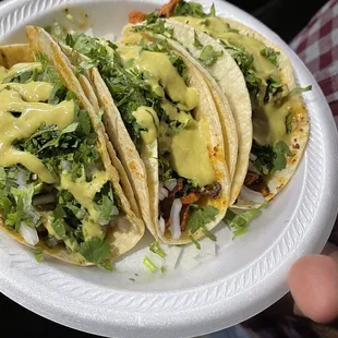 Taco de chicharron en salsa verde and beef fajita tacos