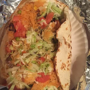 I asked to get a burrito with medallion, cilantro, rice , beans and carne asada only. Instead I got this, So disappointing. Never go back!