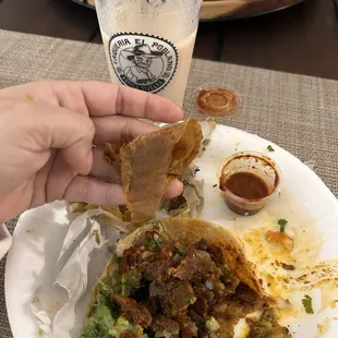 Al pastor taco with paper