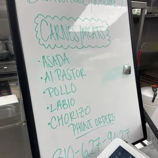 a menu on a white board