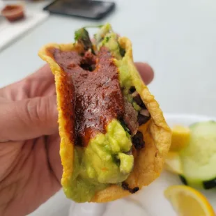 Asada taco with spicy sauce
