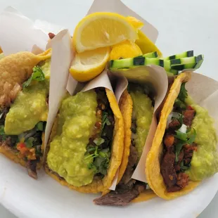 3 tacos asada with everything and 3 tacos al pastor