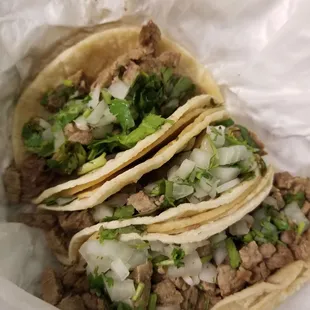 Unseasoned carne asada and gummy tortillas