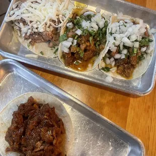 one AL PASTOR TACO, bean and cheese taco, two chicharrón tacos.