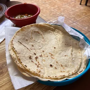 a tortilla and a bowl of salsa