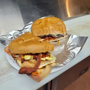 two sandwiches on tin foil