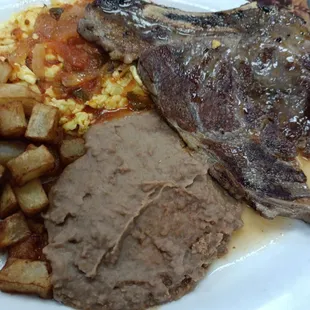 Huevos ranchero with steak