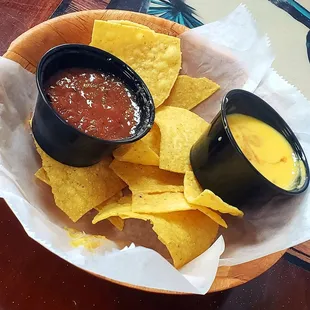 Fresh hot crunchy tortillas w hot (as in not cold) sauce and cheese