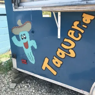a taqueria truck with a cartoon character on the side
