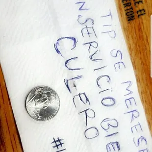 This reads in Spanish "THIS TIP IS WORTH YOUR SHITTY ASS SERVICE 5 CENTS #THETRUTH