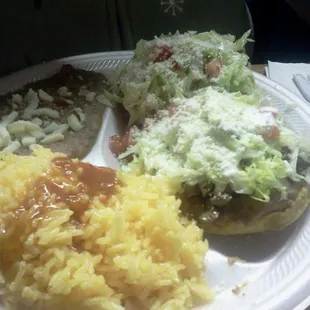 Sopes with beans &amp; rice. Flat fried bread with meat, lettuce, tomatoes and guac. Good stuff!