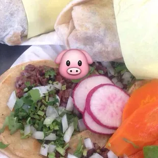 Al Pastor burritos and Cabeza tacos
