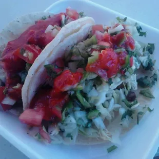 The infamous carne asada taco, loaded with sides and their hot salsa. Bomb people!
