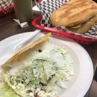 a plate of salad and a sandwich