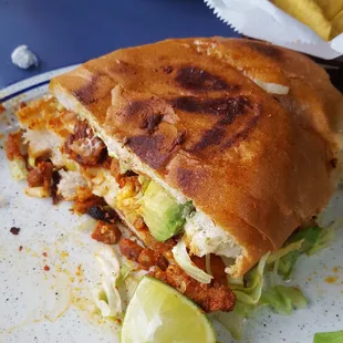 Torta Al Pastor, this is half of the delicious sandwich i was served. Sooo good!