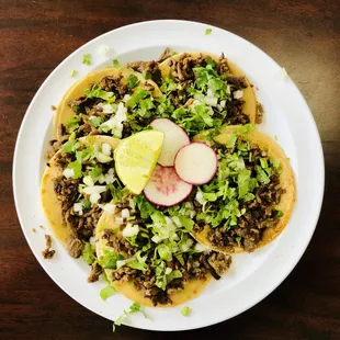 a plate of tacos on a table