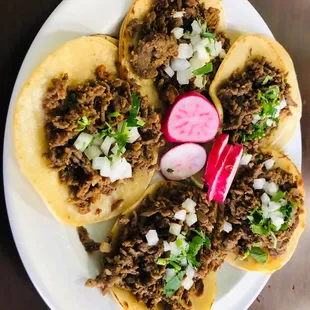 a plate of tacos on a table