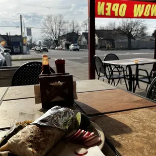 Burrito con pollo on the patio, served with grilled onions and a jalapeño