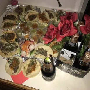 a variety of tacos and drinks