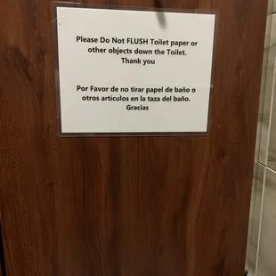 Dirty bathroom with feces in trash can