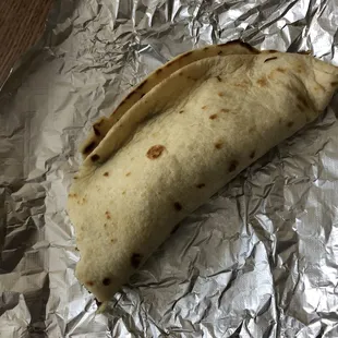 a burrito wrapped in foil