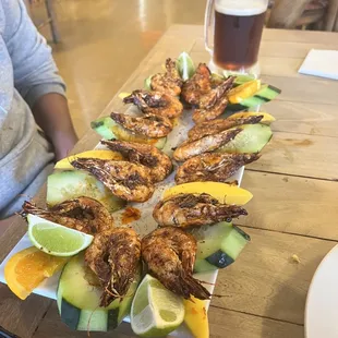 a platter of grilled shrimp
