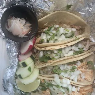 Chicken tacos and carnitas tacos. Also new onion and habanero garnish for those who like spicy.