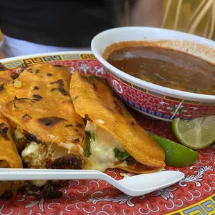 Birria tacos Beef tacos with cheese Beef consumé with cilantro and lime