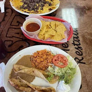 Chicken flautas, chips and salsa, and beef nachos