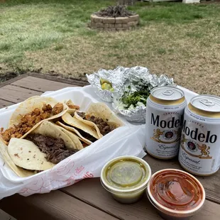 a picnic table with food and drinks