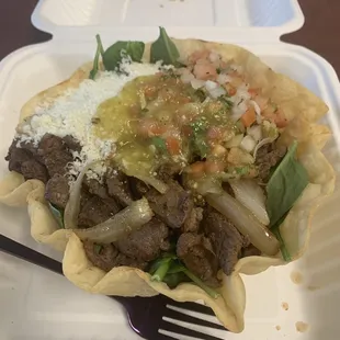 Went back for the taco salad:  Beef, spinach, whole pinto beans (no rice) pico, grilled onions, cotija cheese, green salsa, and guac.