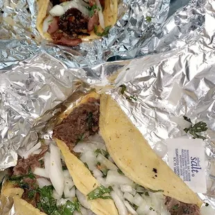 Tripas Taco in the back and Barbocoa Taco towards the front