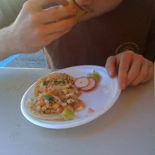 a man eating a taco