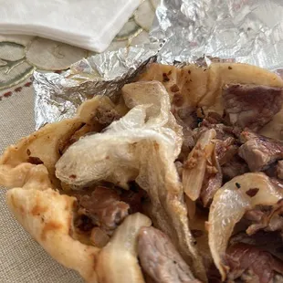 Bought a fajita taco and it came with plastic bundled up (stretch wrap) inside the taco.