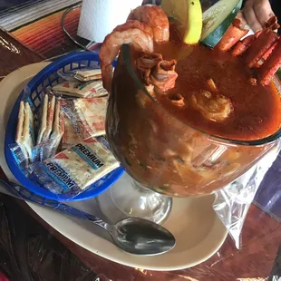 a large bowl of soup with shrimp